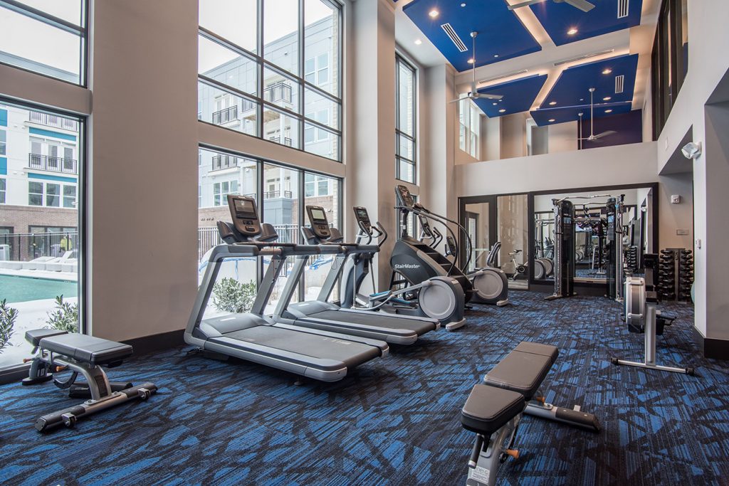 Fitness center with cardio machines, ellipticals, and strength training equipment