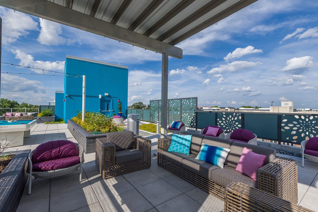 Rooftop lounge with covered lounge seating and community garden