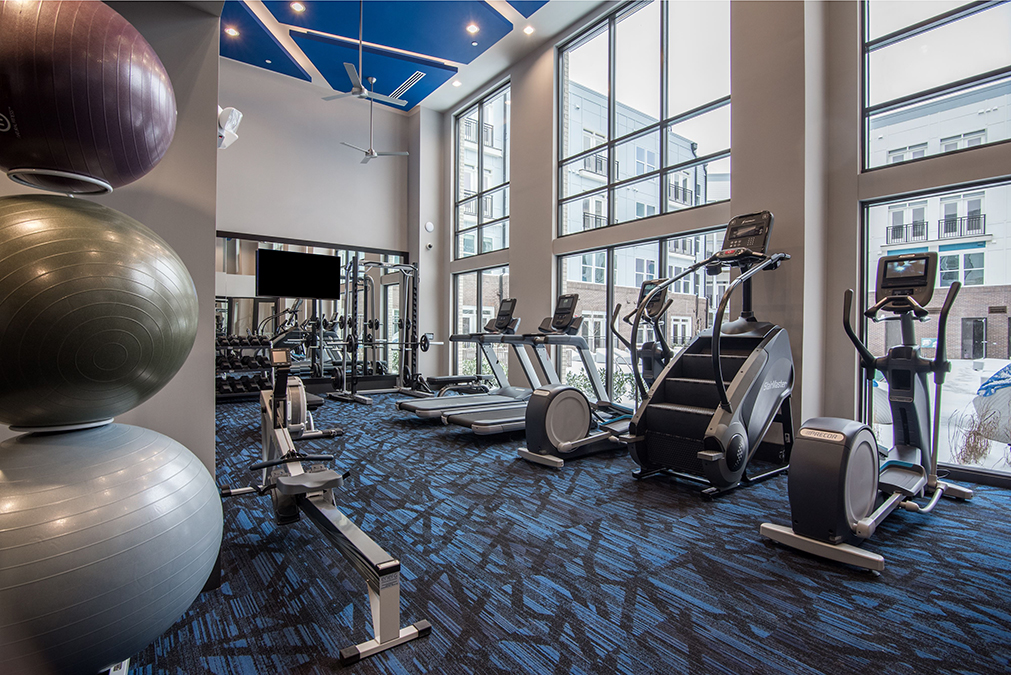 Fitness center with treadmills, stairmaster, and elliptical machines